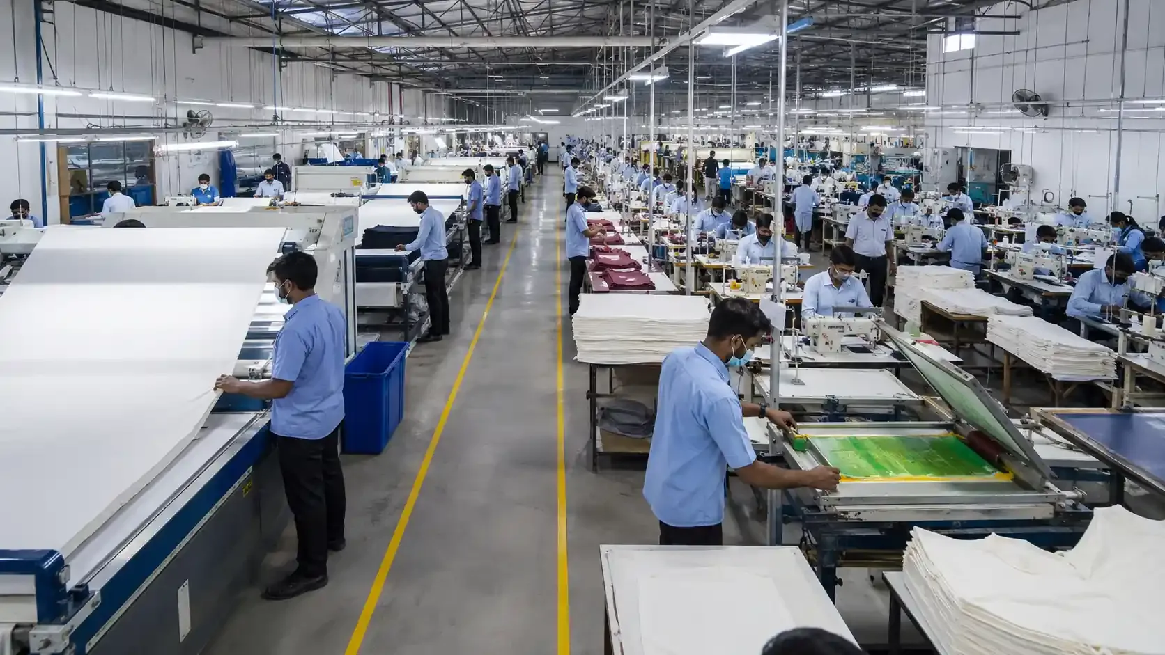 Apparel manufacturing process showing fabric inspection, cutting, sewing, finishing, packing, and final AQL quality inspection.