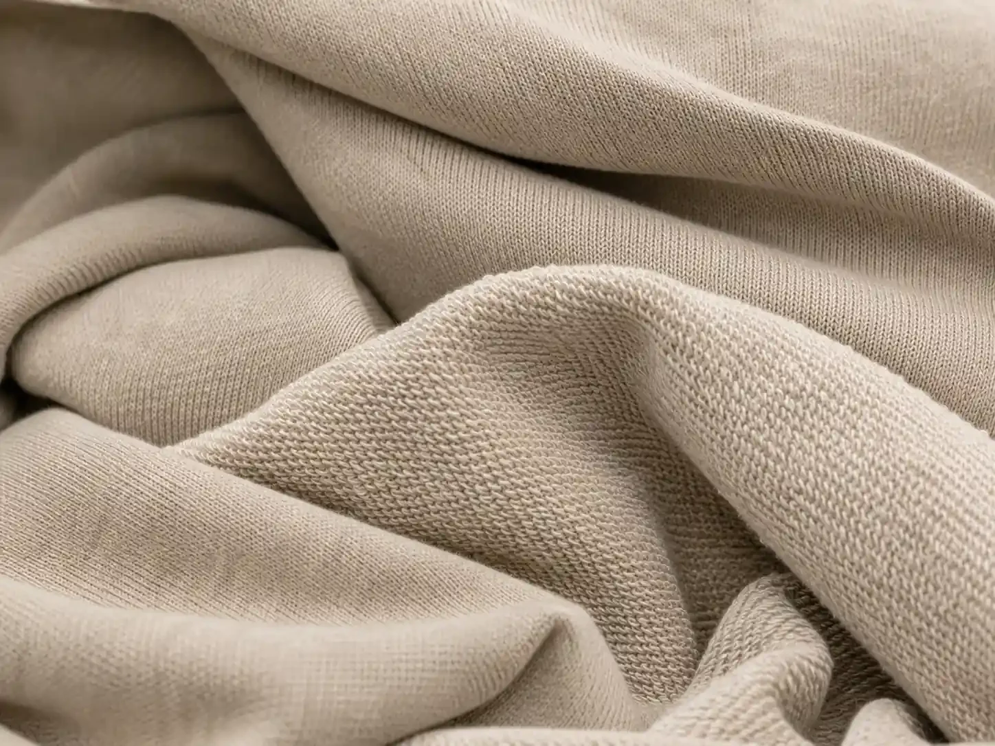 Close-up texture of heavyweight French Terry cotton fabric used for premium oversized hoodie manufacturing.